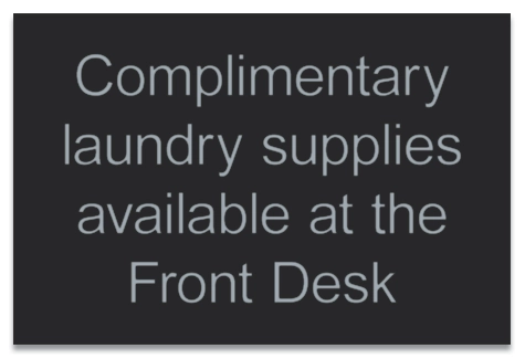 Complimentary Laundry Supplies at Front Desk Sign